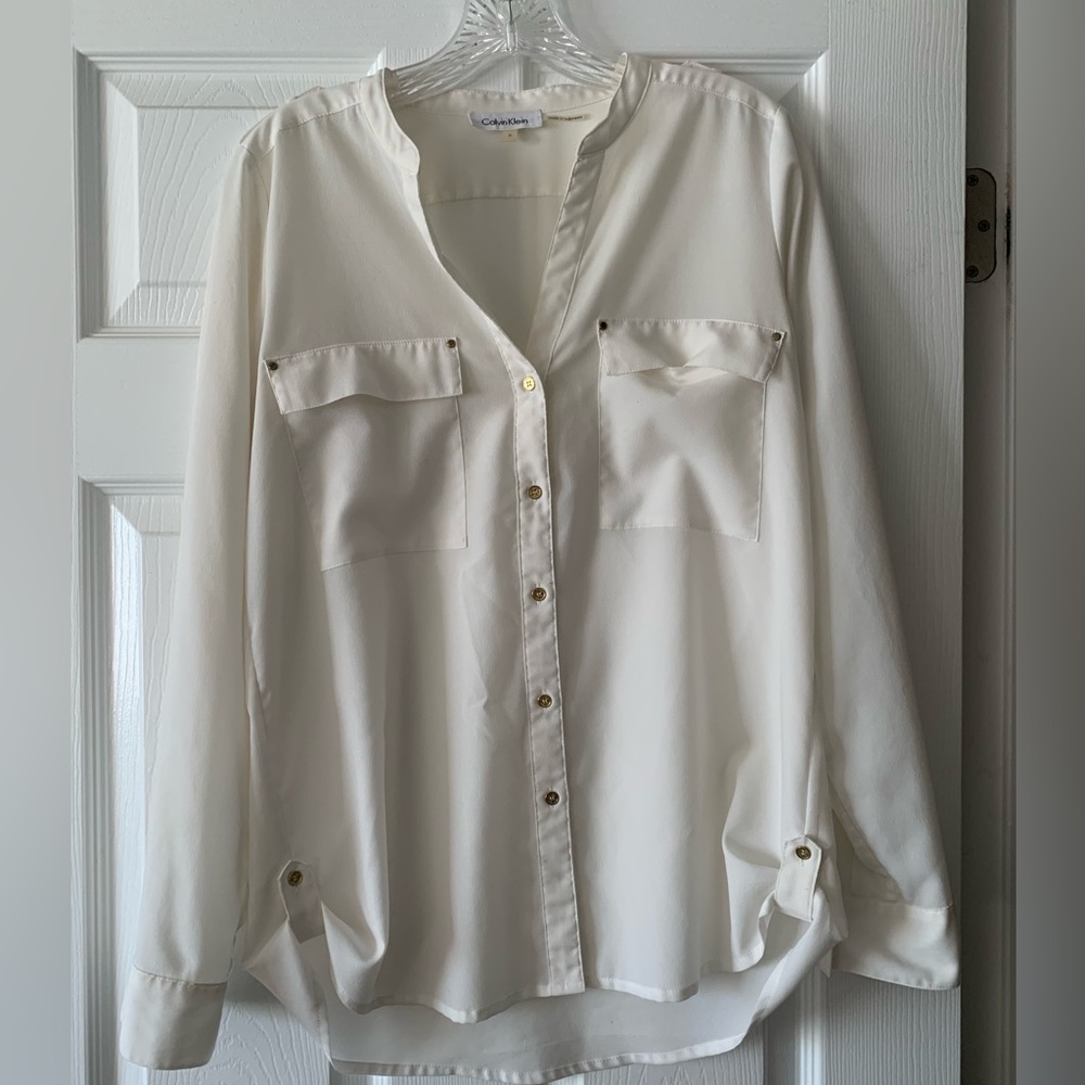 White Calvin Klein blouse.